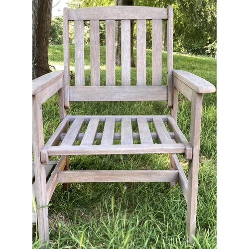 144 - CONVERSATION GARDEN SEAT, weathered slatted teak with two armchairs and conjoining two tier table, 1... 