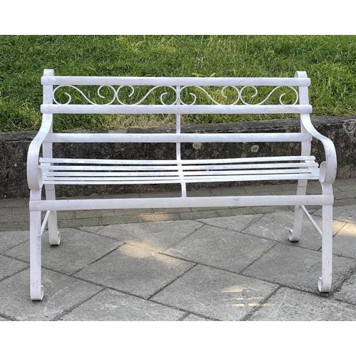 146 - GARDEN BENCH, antique wrought iron and white painted with slatted back and seat and scroll arms, 120... 