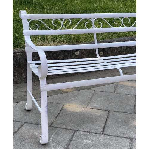 146 - GARDEN BENCH, antique wrought iron and white painted with slatted back and seat and scroll arms, 120... 