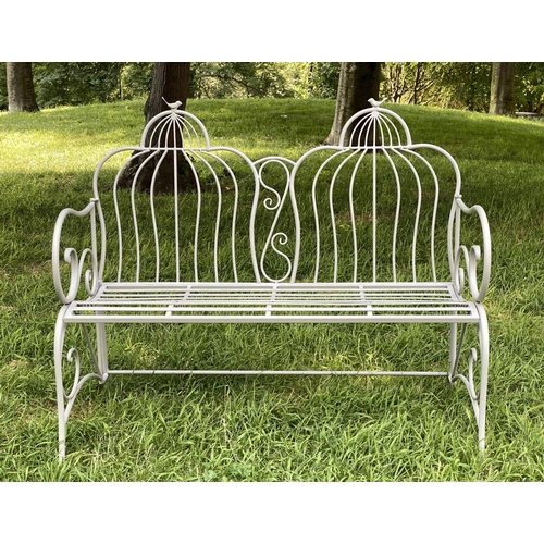 150 - FOLDING GARDEN BENCH, painted wrought iron with raised back and scroll arms, 112cm W.