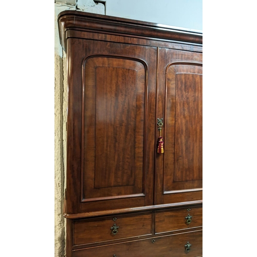 167 - LINEN PRESS, Victorian mahogany, circa 1860, with two panelled doors enclosing ticking lined hanging... 