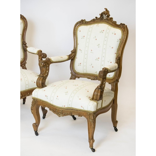 184 - FAUTEUILS, 105cm H x 64cm W, a pair, late 19th century French walnut and gilt heightened in cream fl... 