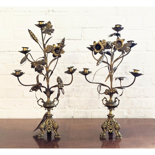 188 - CANDLESTICKS, a pair, brass grain, flower and grape detail, each 58cm H. (2)