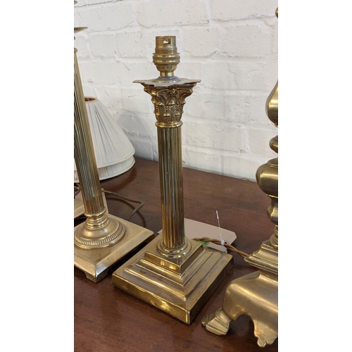 189 - BRASS LAMPS, a pair, each 46cm H including fitting (plugs lacking) and a smaller column lamp 36cm H ... 