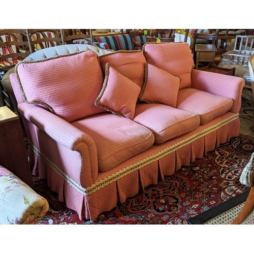 191 - SOFA, country house style in pink patterned fabric with tufted detail, 205cm x 107cm.