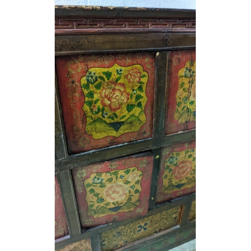 206 - TIBETAN CABINET, 40cm D x 109cm x 116cm H, 19th century red lacquer with floral detail.