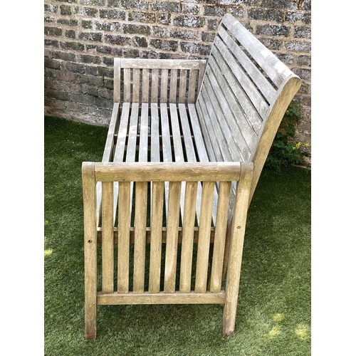 221 - GARDEN BENCH, weathered teak with horizontal slat back and seat and downswept arms by 'Trinity', 162... 