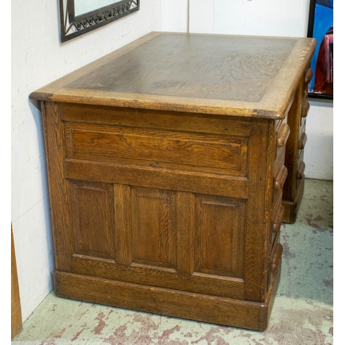 258 - DESK, 77cm H x 122cm W x 80cm D, circa 1925 oak with two slides and eight drawers.