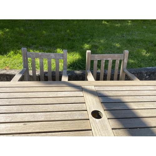 279 - GLOSTER GARDEN TABLE AND BARLOW-TYRIE ARMCHAIRS, silver weathered teak, table 176cm W x 90cm D x 70c... 