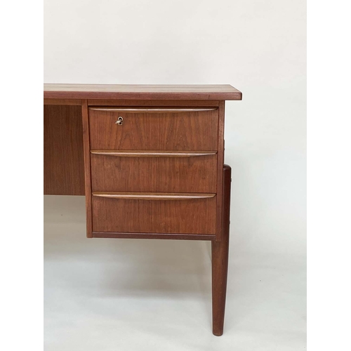 285 - DESK, 1970's Danish teak with six frieze drawers and tapering supports, 130cm x 71cm x 74cm H.