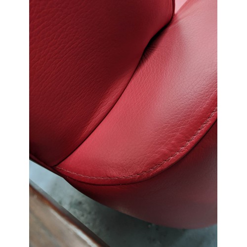 302 - LOUNGE CHAIRS, a pair, swivel design red leather upholstere,d polished metal base, 80cm x 80cm x 85c... 