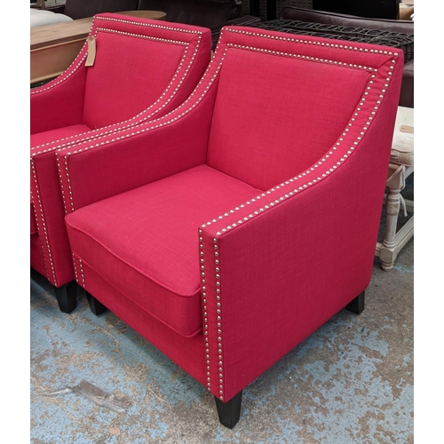 346 - ARMCHAIRS, a pair, each 75cm W x 91cm, red fabric upholstered with studded detail and footstool set.... 