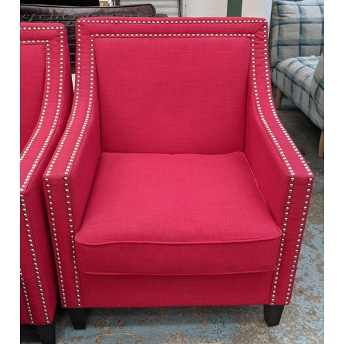 346 - ARMCHAIRS, a pair, each 75cm W x 91cm, red fabric upholstered with studded detail and footstool set.... 