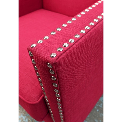 346 - ARMCHAIRS, a pair, each 75cm W x 91cm, red fabric upholstered with studded detail and footstool set.... 