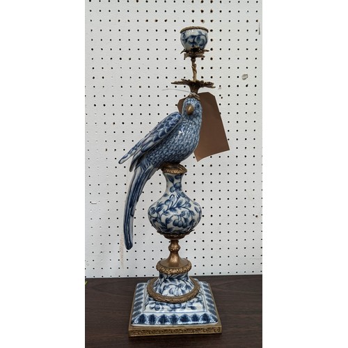 353 - CANDELABRUM, 48cm H, in the form of a cockatoo, blue and white ceramic, gilt metal mount.