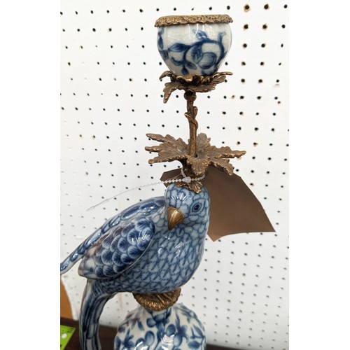 353 - CANDELABRUM, 48cm H, in the form of a cockatoo, blue and white ceramic, gilt metal mount.