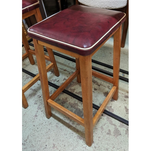 388 - BAR TABLE, 120cm W x 45cm D x91cm H, wooden top and black metal base and two stools, red seats with ... 