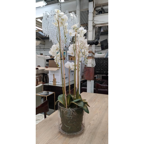 391 - FAUX ORCHID DISPLAY, 135cm H, in a glass bowl.