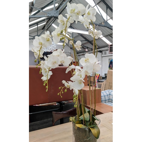 391 - FAUX ORCHID DISPLAY, 135cm H, in a glass bowl.