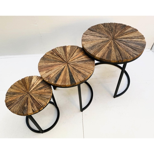 404 - NEST OF TABLES, graduated set of three, largest measuring 46cm high, 45cm diameter, metal bases. (3)