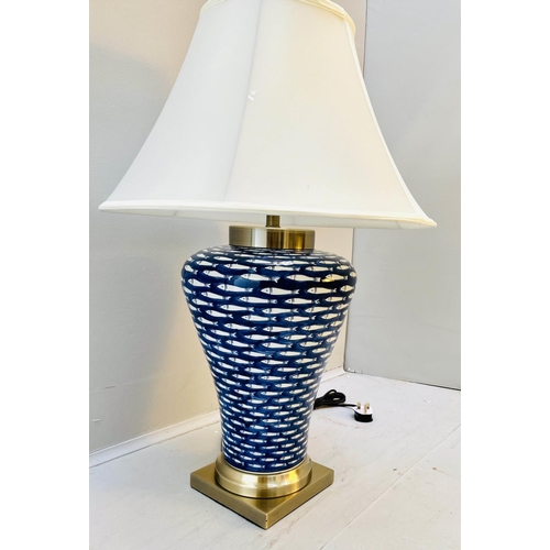 406 - TABLE LAMP, 74cm high, 50cm diameter, blue and white ceramic with fish design, shade.