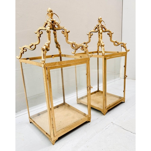 407 - STORM LANTERNS, 60cm high, 27cm wide, a pair, square sectioned, gilt metal frames glazed sides. (2)