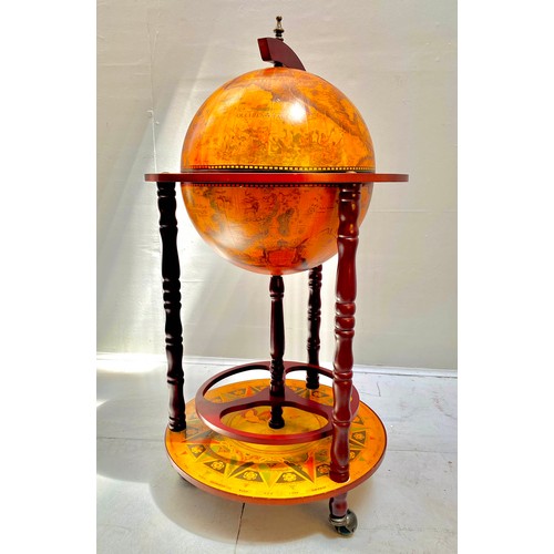 411 - TERRESTRIAL GLOBE COCKTAIL CABINET, 90cm high, 50cm diameter, raised on castors.