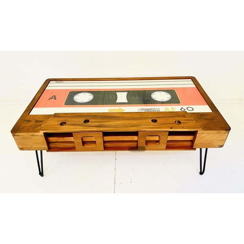 414 - LOW TABLE, 40cm high x 110cm wide x 60cm deep, cassette tape design, with storage to one side.