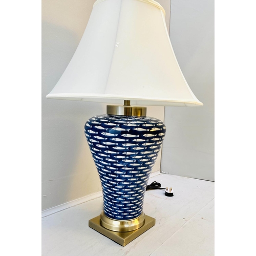 366 - TABLE LAMP, 74cm high, 50cm diameter, blue and white ceramic with fish design, shade.
