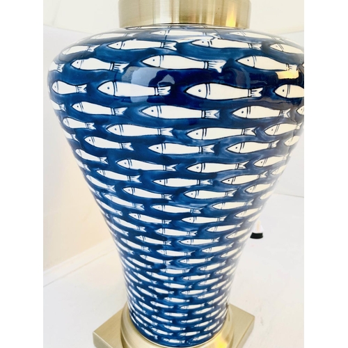 366 - TABLE LAMP, 74cm high, 50cm diameter, blue and white ceramic with fish design, shade.