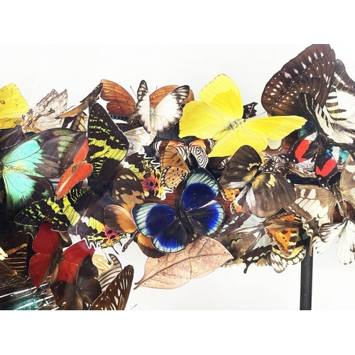 1 - BRAN SYMONDSON (b1971), 'Beat of a wing', decommissioned AK47, mounted with real butterflies and sym... 