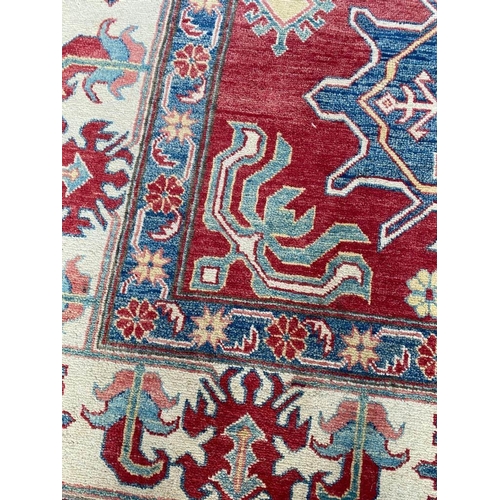 126 - FINE EAGLE KAZAK CARPET, 355cm x 265cm.