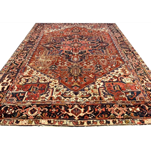 128 - ANTIQUE PERSIAN HERIZ CARPET, 350cm x 255cm.