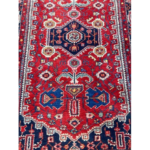 129 - NORTH WEST PERSIAN RUNNER, 295cm x 80cm.