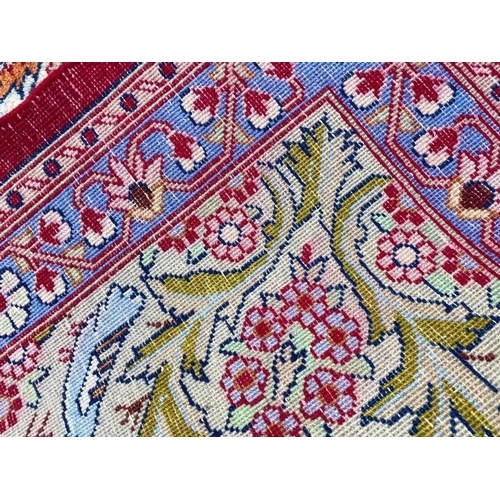 132 - PERSIAN QUM CARPET, 375cm x 275cm.