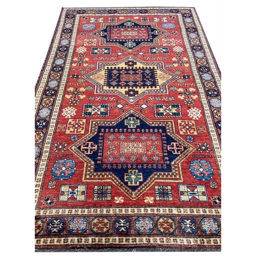 135 - LESGHI KAZAK RUG, 220cm x 140cm.