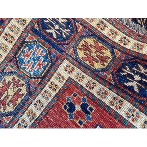 135 - LESGHI KAZAK RUG, 220cm x 140cm.