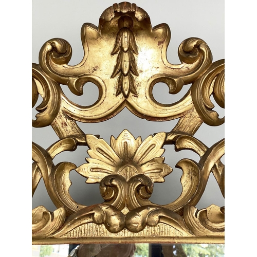 169 - FLORENTINE WALL MIRROR, late 19th/early 20th century, carved giltwood with bevelled mirror plate and... 