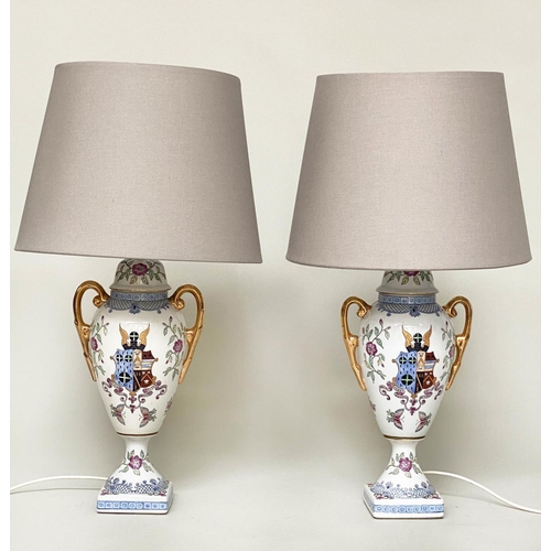 171 - TABLE LAMPS, a pair, urn shaped glazed ceramic each with armorial crest and twin gilded handles with... 