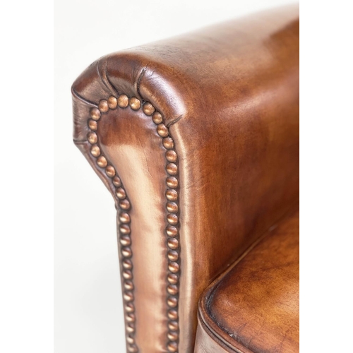 189 - ARMCHAIRS, a pair, club style brass studded tan leather with scroll arms and back and tapering suppo... 