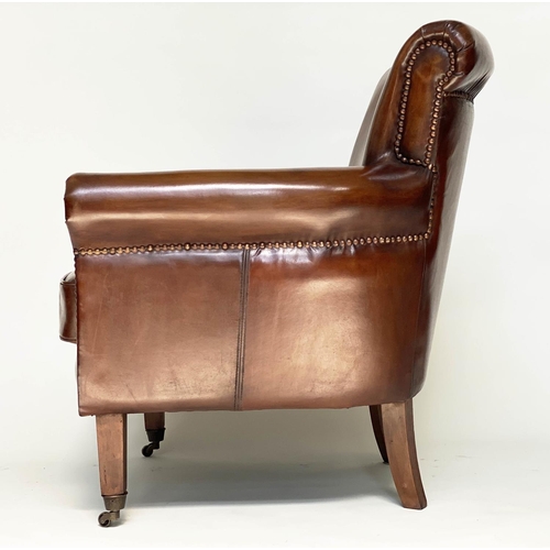 189 - ARMCHAIRS, a pair, club style brass studded tan leather with scroll arms and back and tapering suppo... 