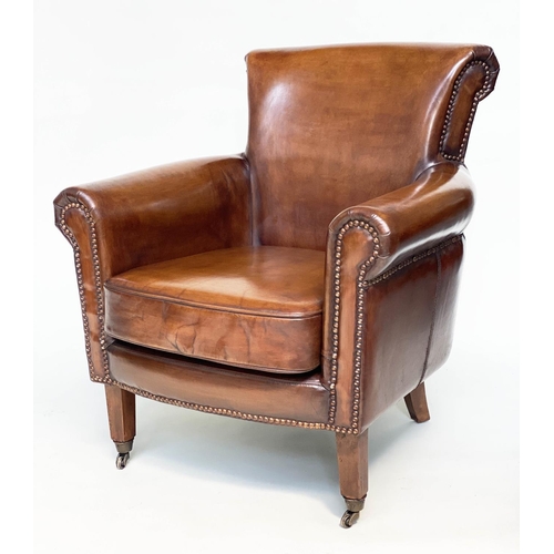 189 - ARMCHAIRS, a pair, club style brass studded tan leather with scroll arms and back and tapering suppo... 