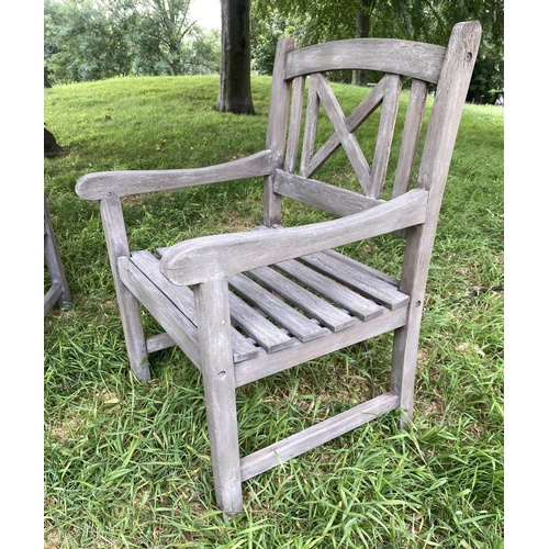 192 - GARDEN ARMCHAIRS, a pair, weathered teak and slatted with lattice backs together with a table, chair... 