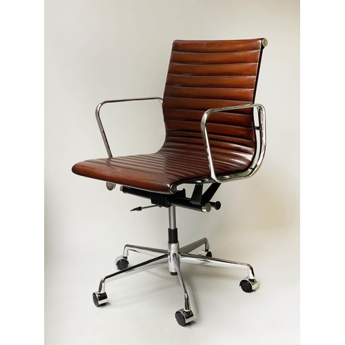 213 - REVOLVING DESK CHAIR, Charles and Ray Eames inspired with ribbed tan leather seat revolving and recl... 