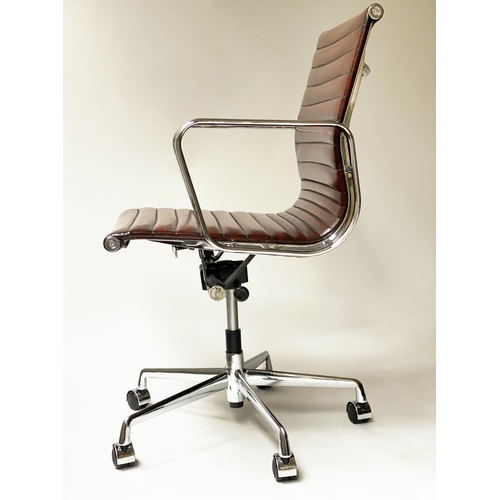 213 - REVOLVING DESK CHAIR, Charles and Ray Eames inspired with ribbed tan leather seat revolving and recl... 