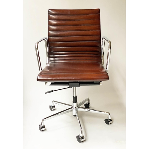 213 - REVOLVING DESK CHAIR, Charles and Ray Eames inspired with ribbed tan leather seat revolving and recl... 