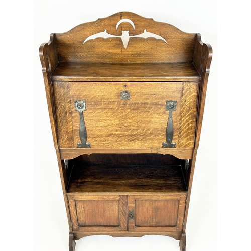 219 - ARTS AND CRAFTS BUREAU, 69cm W x 133cm H x 26cm D, Liberty style oak, with  pierced bat and crescent... 