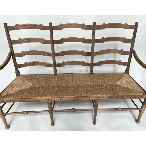 241 - HALL SEAT, early 20th century English oak with raised ladder back and rush seat, 157cm W.