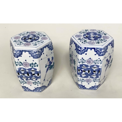 272 - CHINESE STOOLS, a pair, Chinese blue and white ceramic of facetted barrel form with pierced detail, ... 