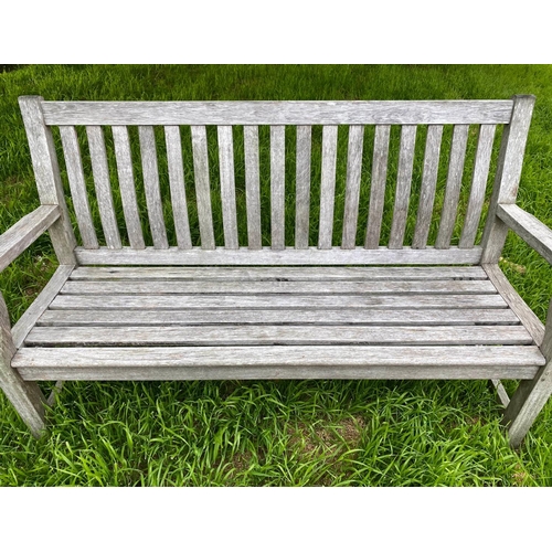 279 - GARDEN BENCH, silvery weathered teak of slatted and pegged construction, 152cm W.